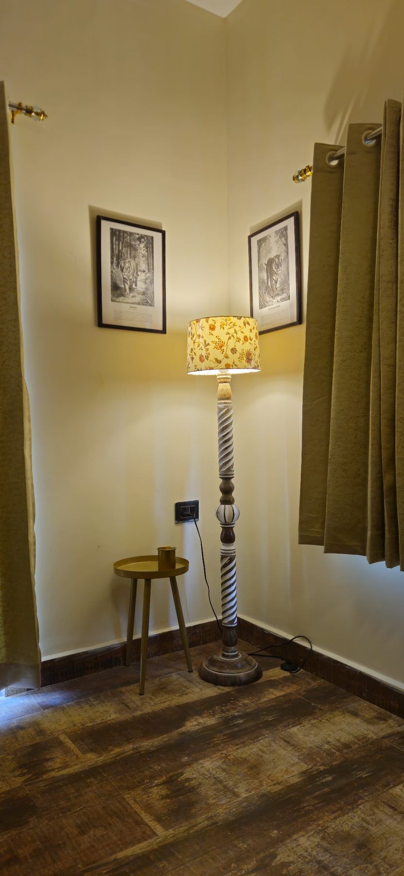 A lamp and side table in a quiet cottage room
