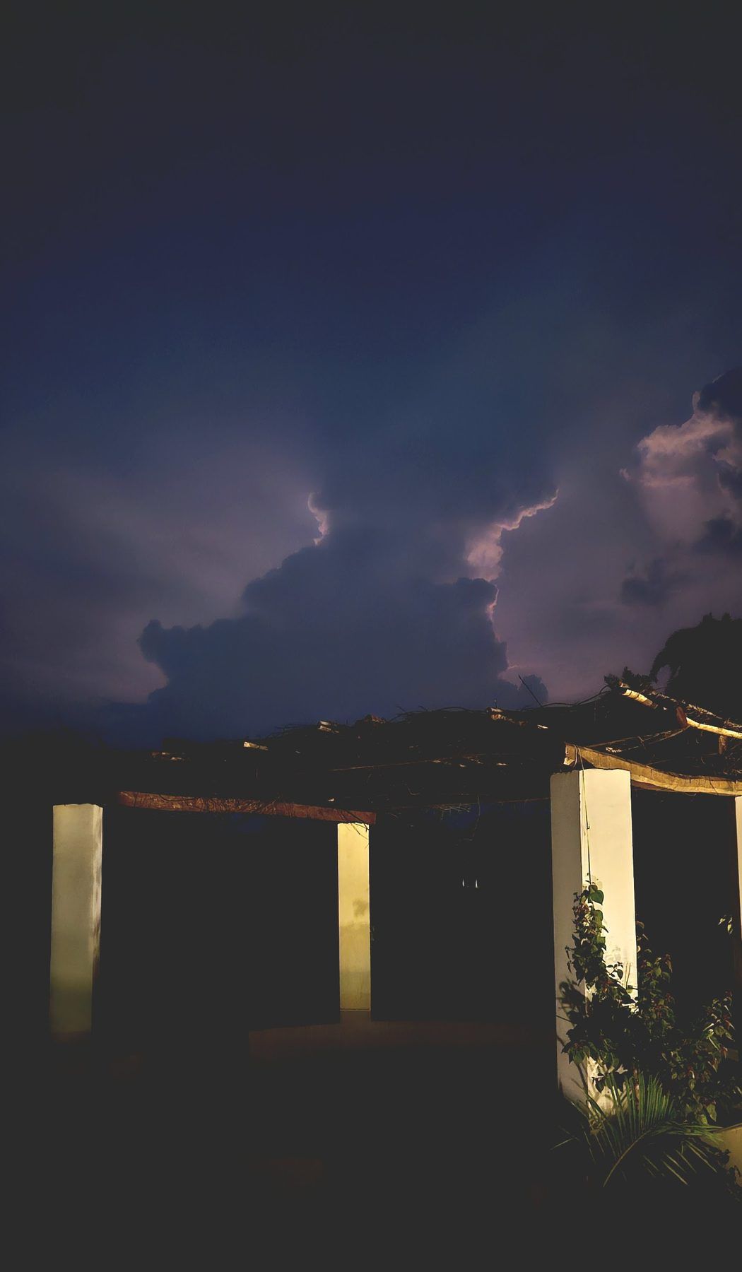 Storm clouds over the pergola at dusk