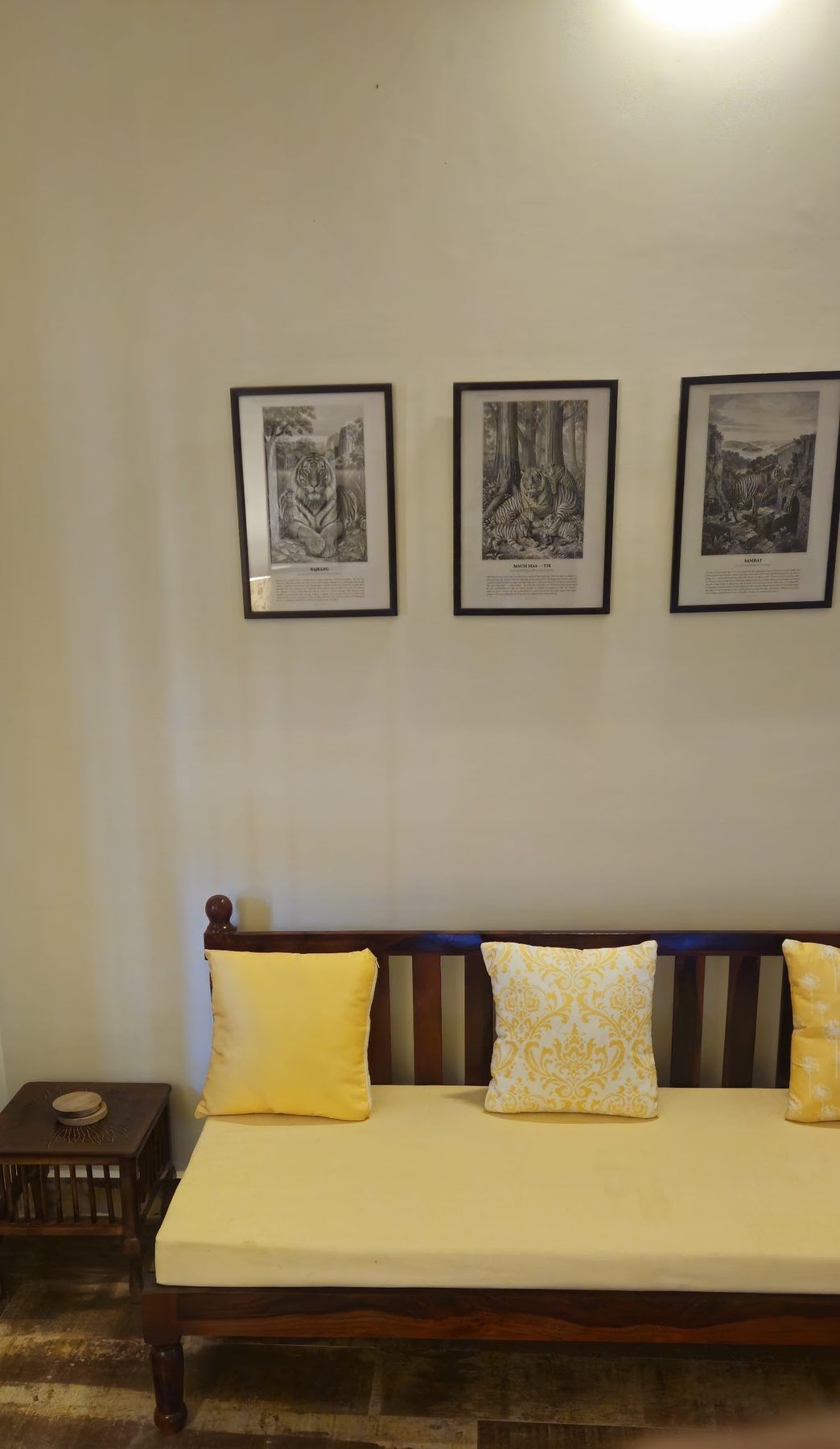 A daybed under framed Palamu engravings