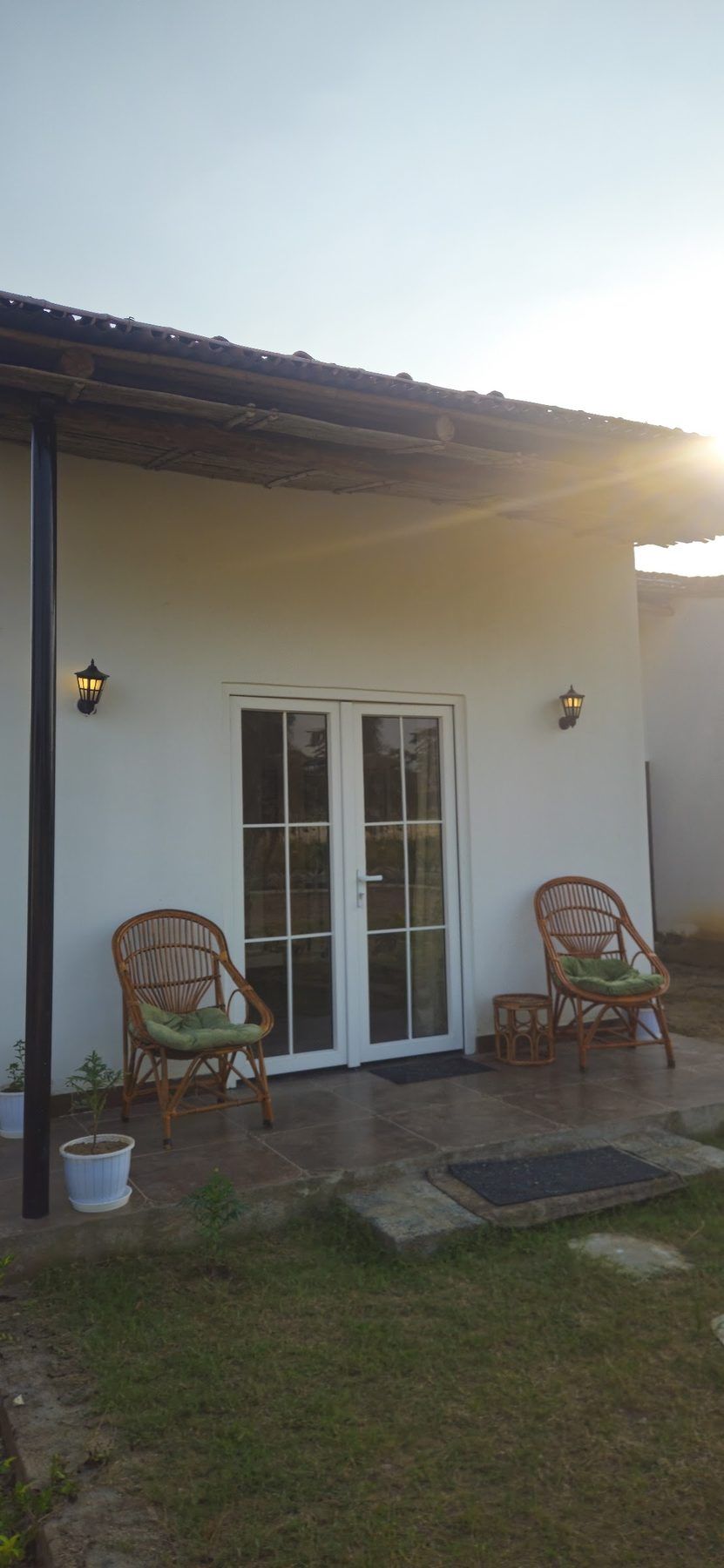 White cottage veranda in morning sun